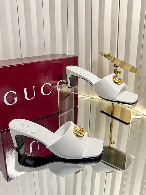 Gucci Slide Sandal With Prominent Gold Tone Interlocking GG Logo