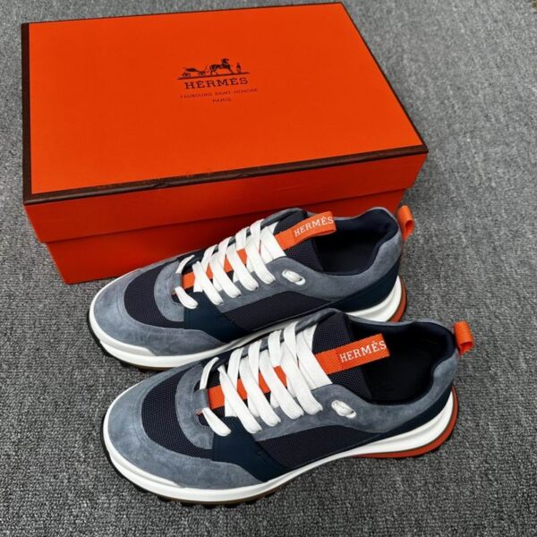 Hermès Leader Sneakers In Blue With Orange Accent Detail