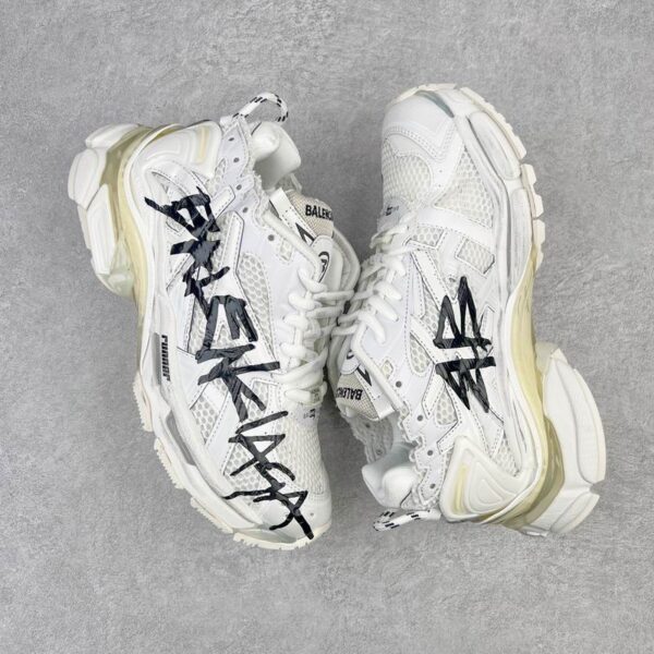 Balenciaga Runner Sneakers With Bold Graffiti Logo Print Across The Side
